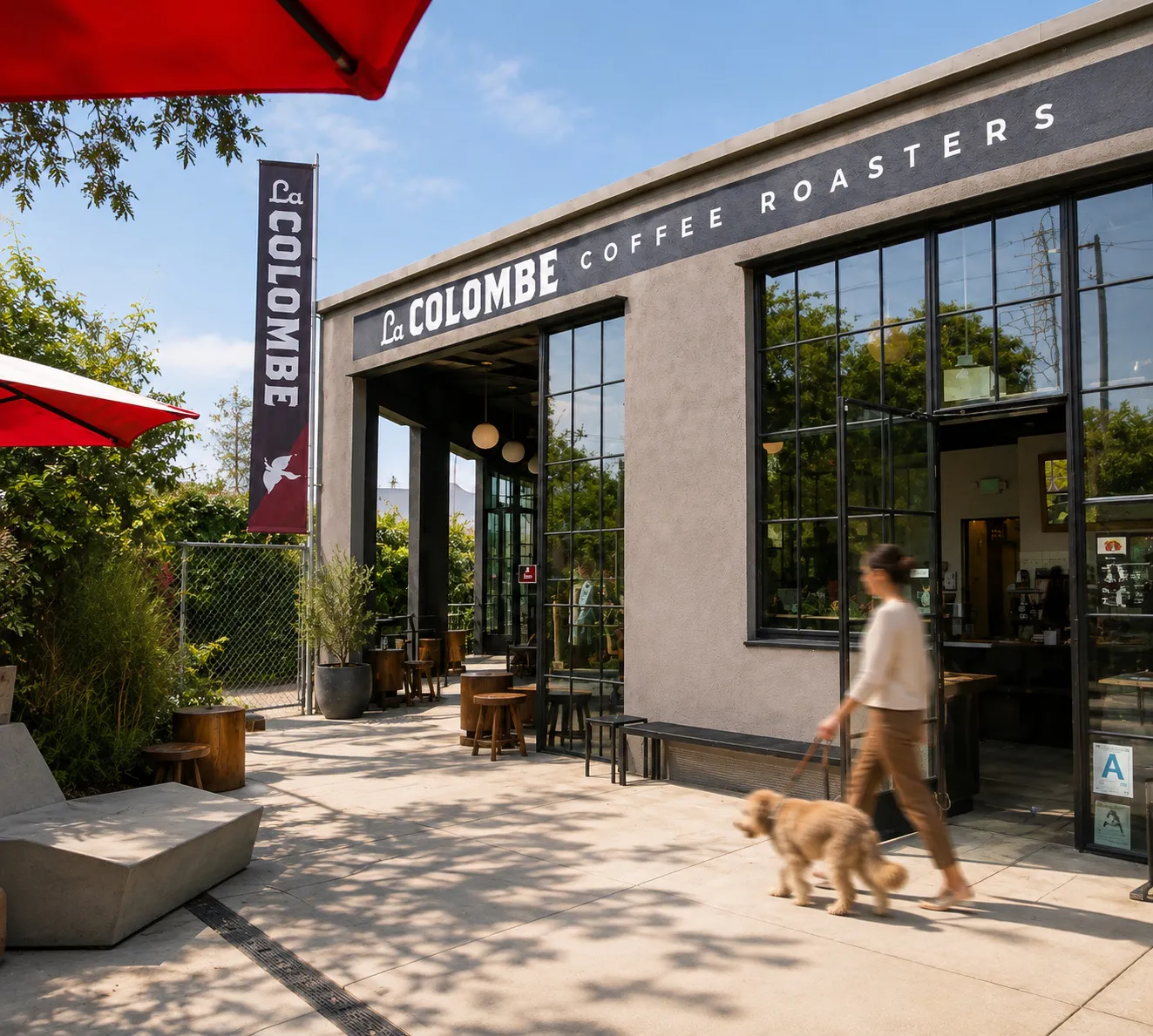 La Colombe coffee roasters' patio in Frogtown with red umbrellas