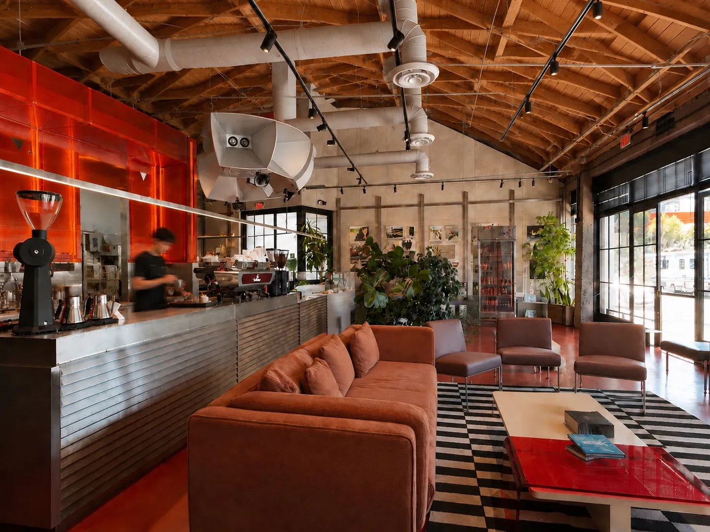 Lumen Coffee's interior — timber ceiling, espresso bar and lounge seating